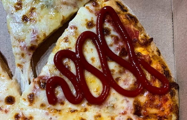 Ketchup on pizza